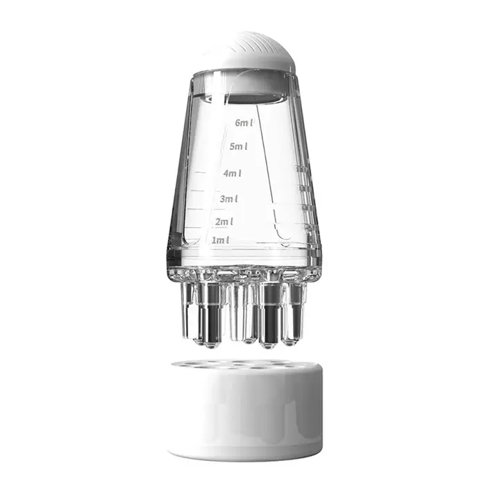Peigne applicateur de sérum pour le cuir chevelu