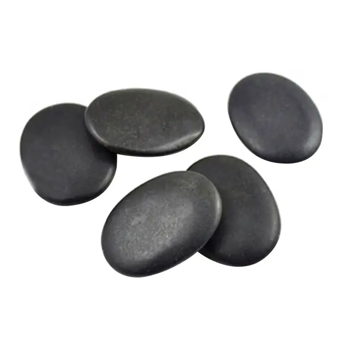 Ensemble de pierres naturelles de massage au charbon chaud