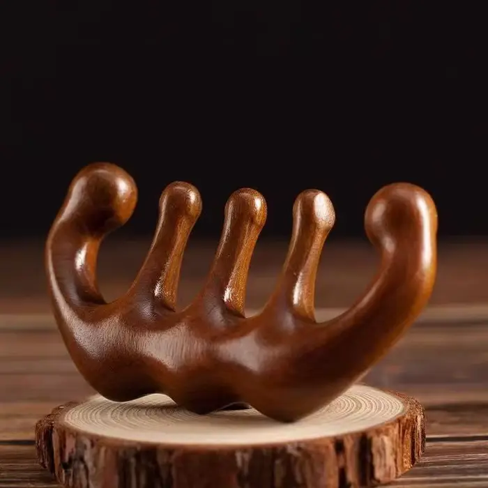 Peigne de massage en bois pour la tête