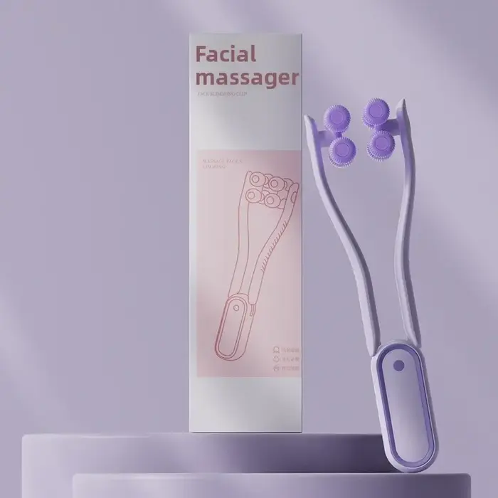 Masseur facial à rouleaux portable multifonctionnel favorisant l'absorption des produits